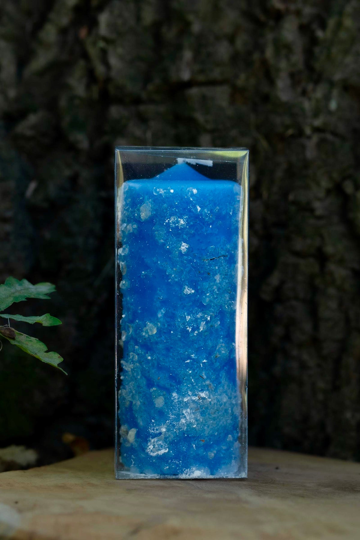 Velón azul decorado Salud y Sanación de Las Velas de Mariano en embalaje transparente.