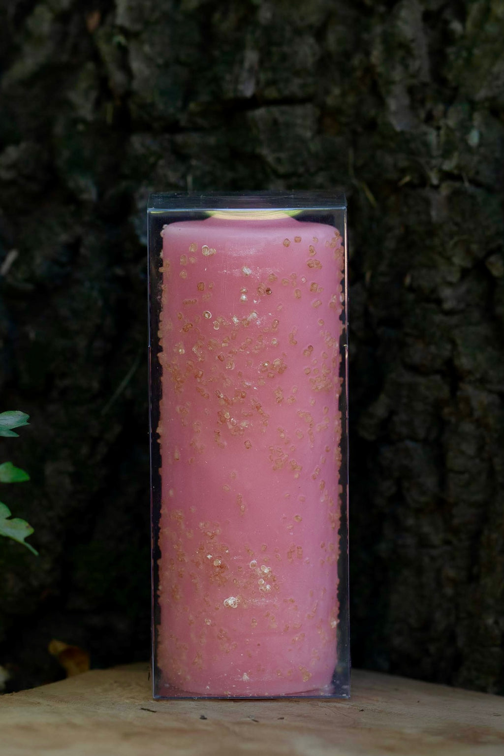 Velón rosa decorado Propósito Amor de Las Velas de Mariano en embalaje transparente.