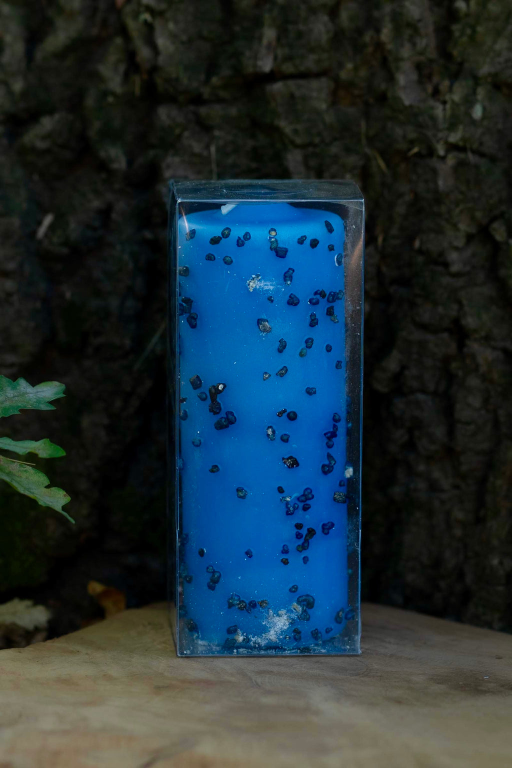 Velón azul decorado Propósito Fertilidad de Las Velas de Mariano en embalaje transparente.